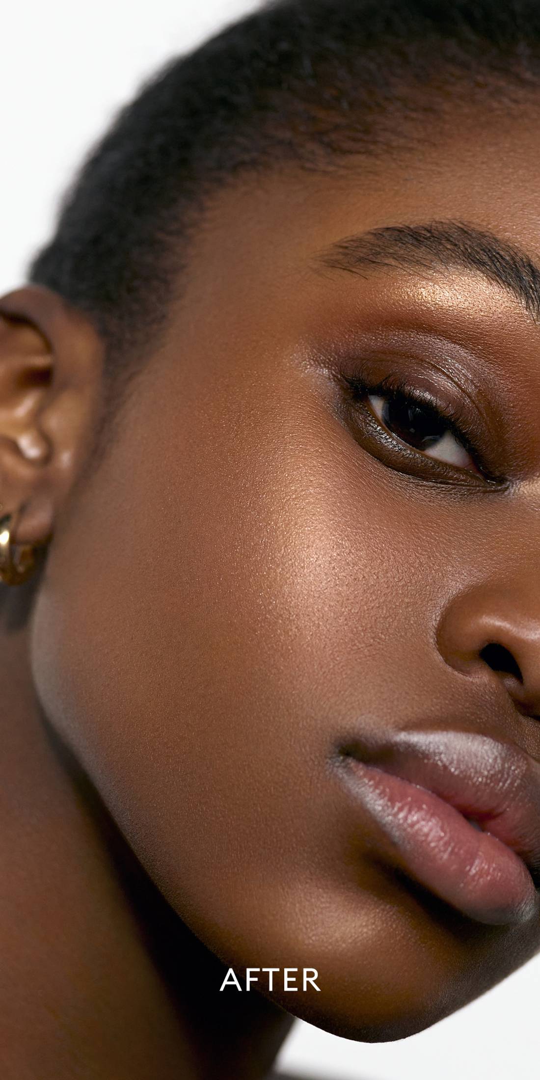 After image of deep skin tone model wearing the Solar Radiance Hydrating Cream Highlight in shade Lustrous 1